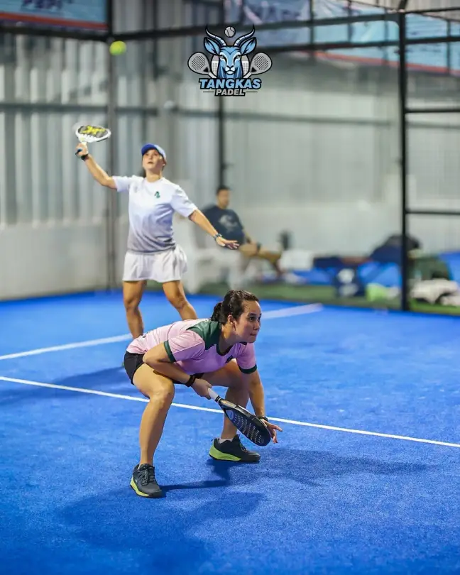 Doubles partners at the net
